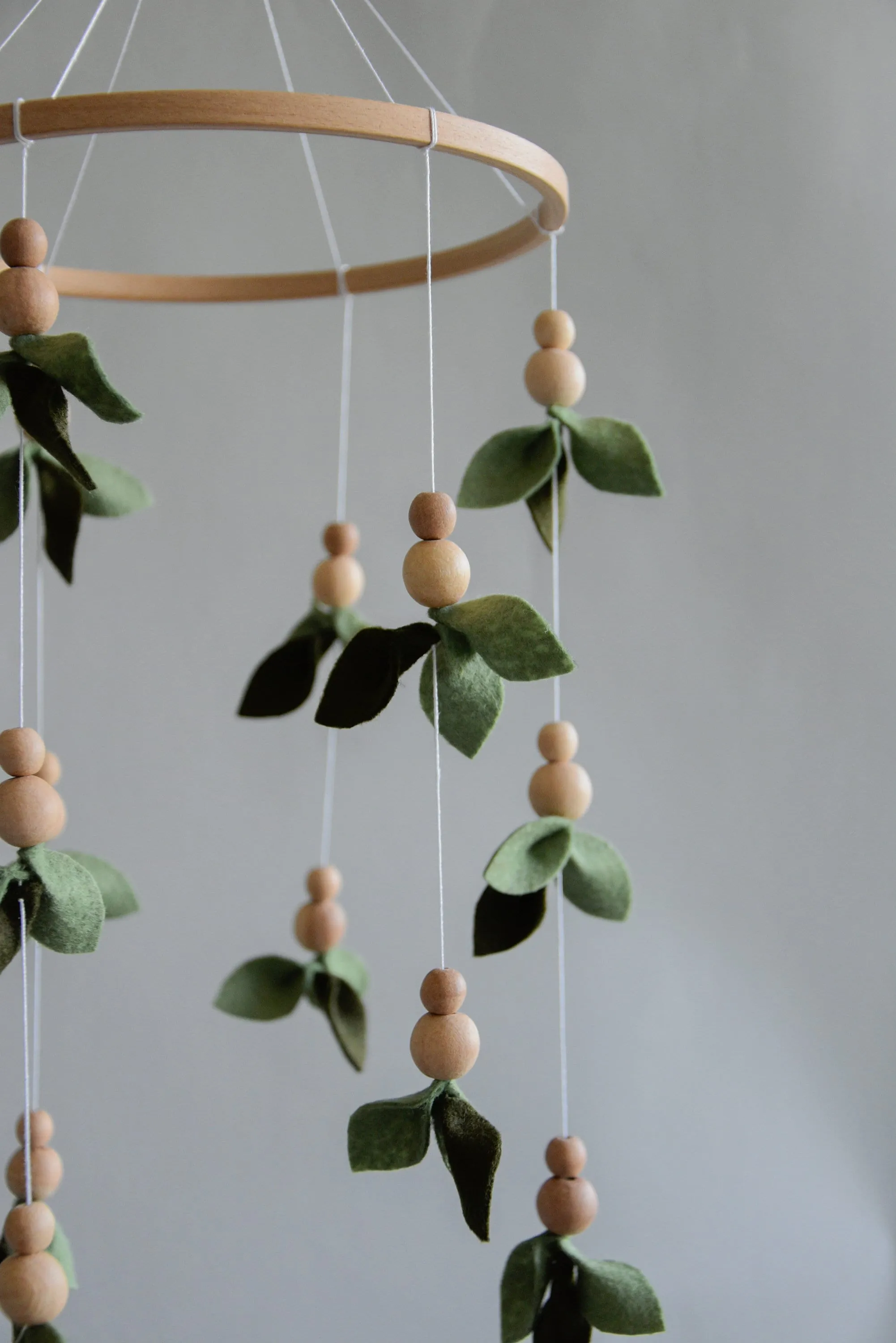 Forest style floral mobile with leaves and wooden pearls