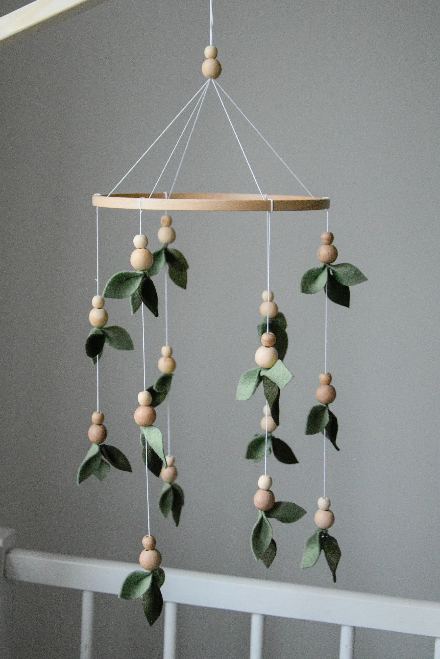 Forest style floral mobile with leaves and wooden pearls