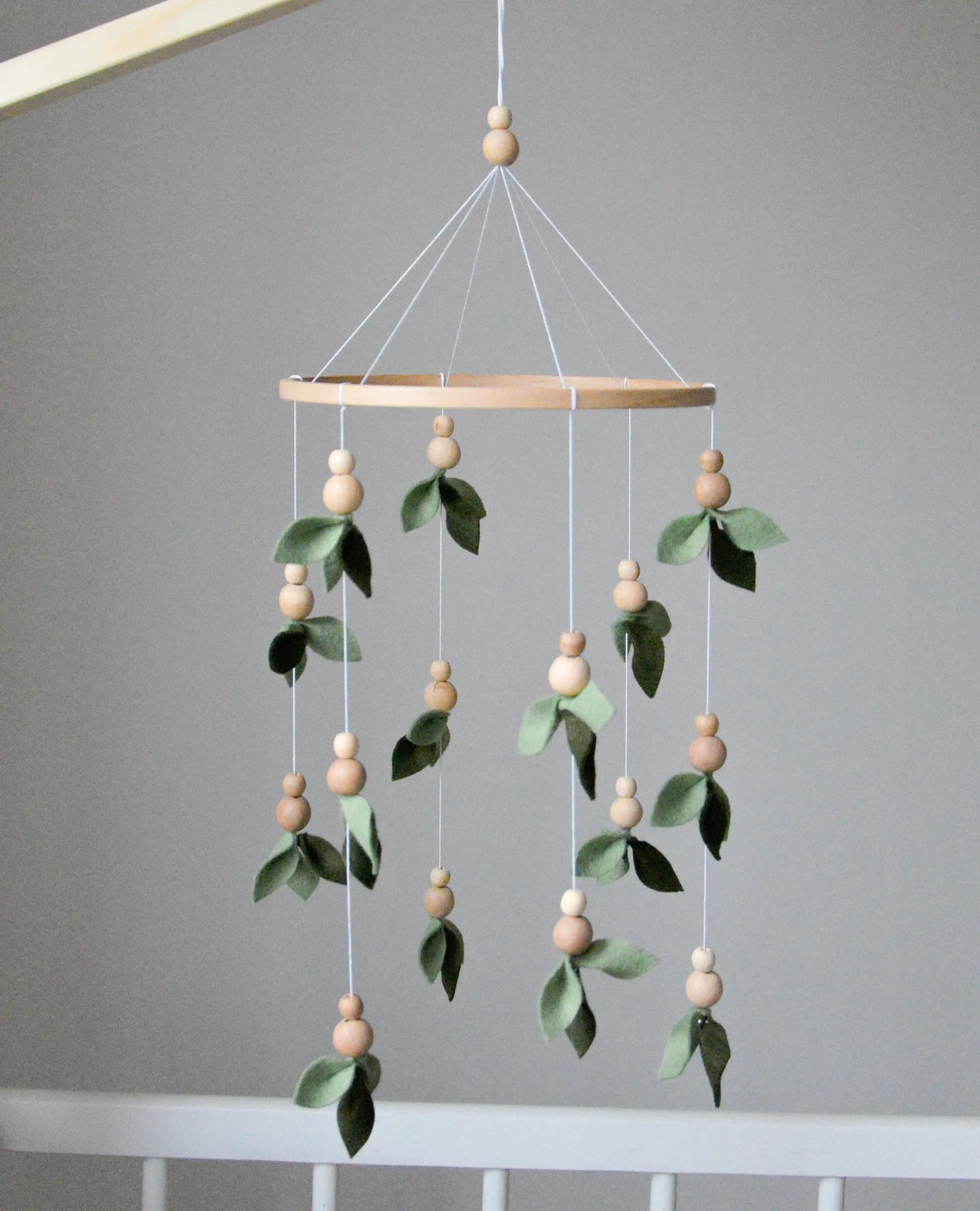 Forest style floral mobile with leaves and wooden pearls